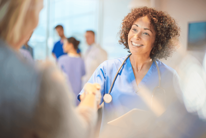 Female doctor greeting patient.png