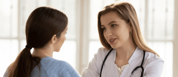 Doctor with nervous female patient.png